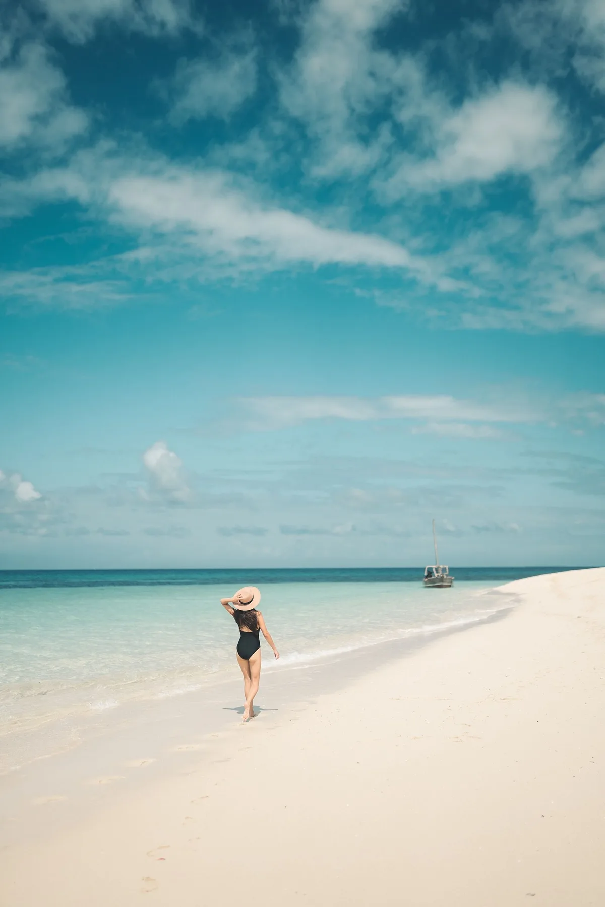 Traveller walking along a Mozambique beach
