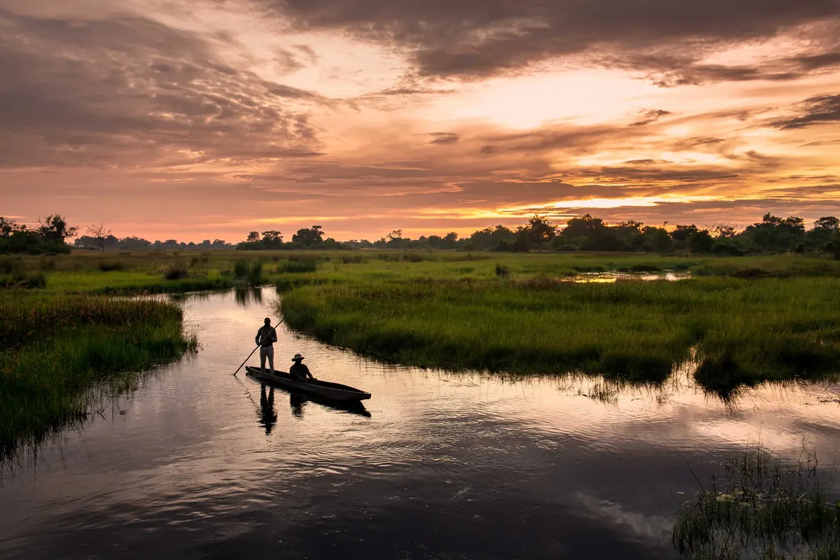 Mokoro crossing Botswana floodplain channels