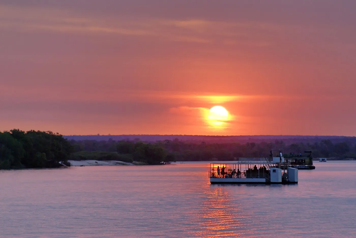 Boat on the Zambezi River at sunset in Zambia